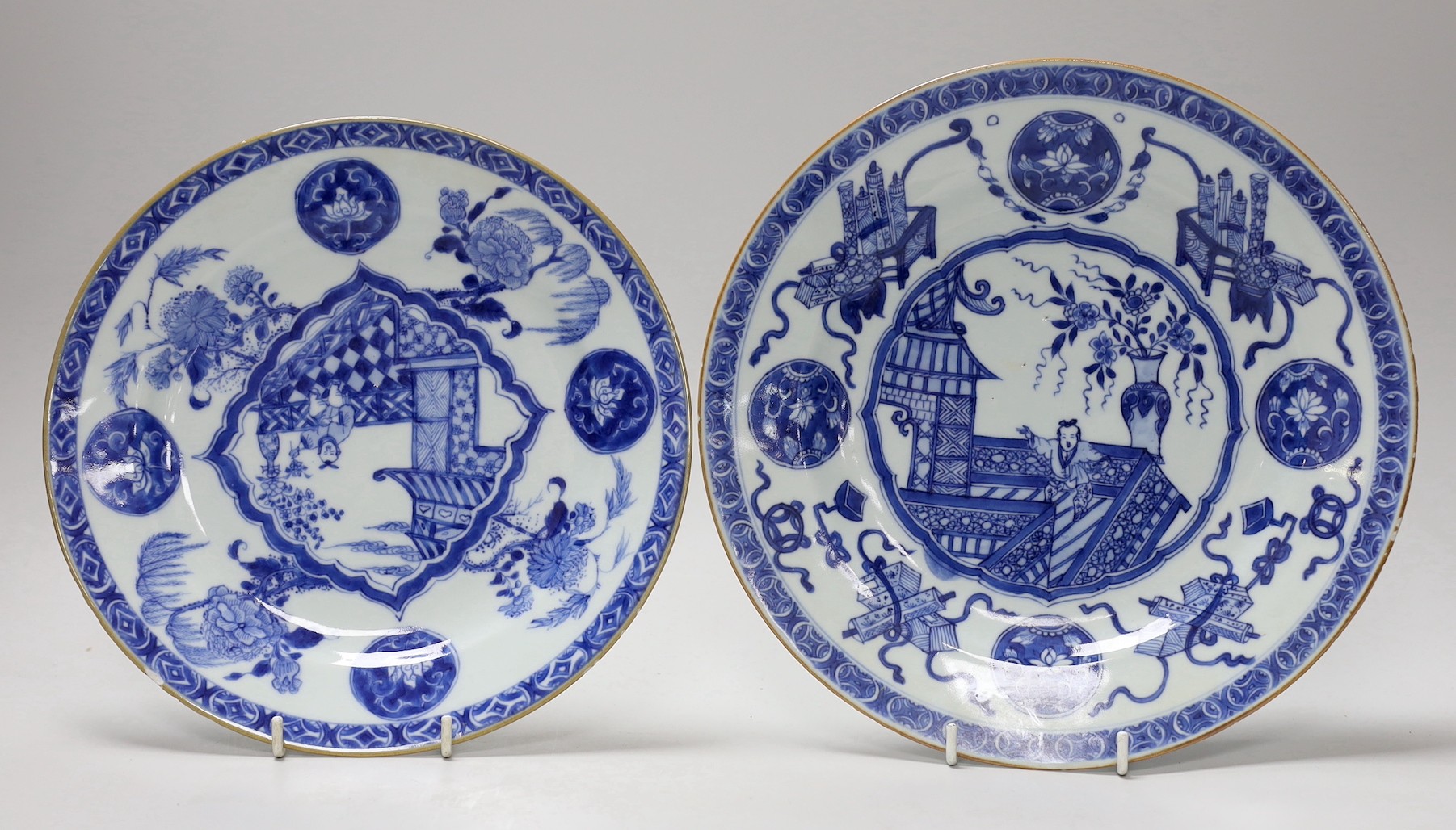 Two Chinese blue and white ‘dancing boy’ dishes, Kangxi period, largest 24.5cm, one with a border of Antiques, the other with foliage